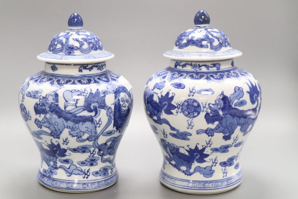 A pair of Chinese blue and white dragon vases, height 26cm